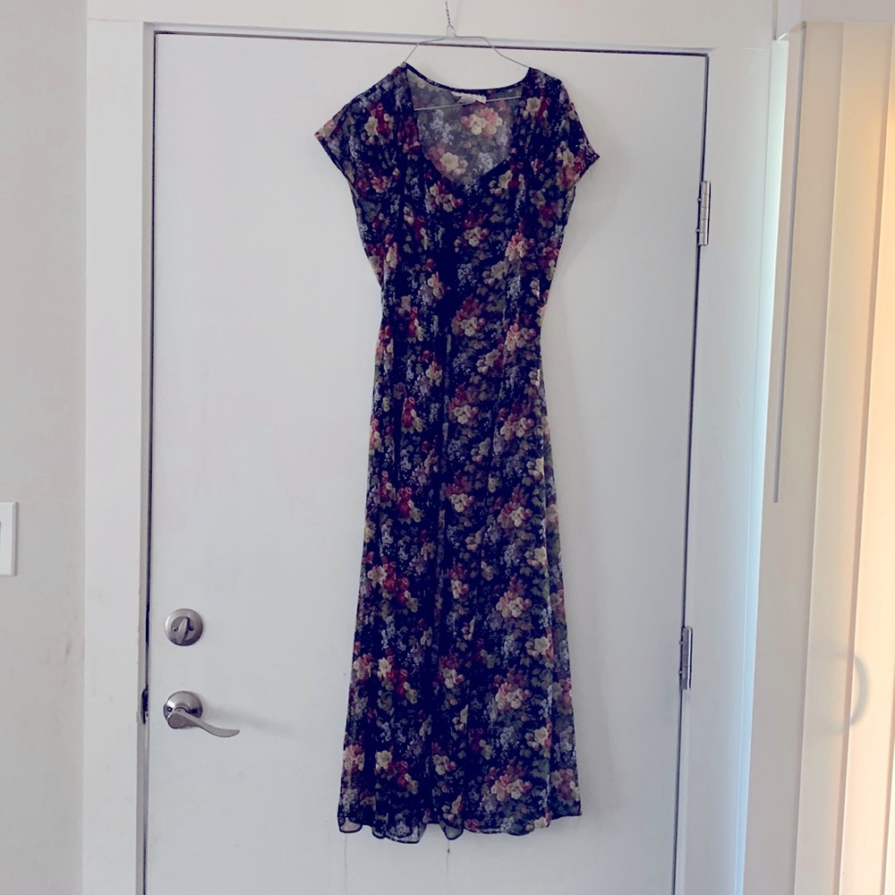 Size 6 see through dress button down black with floral pattern.